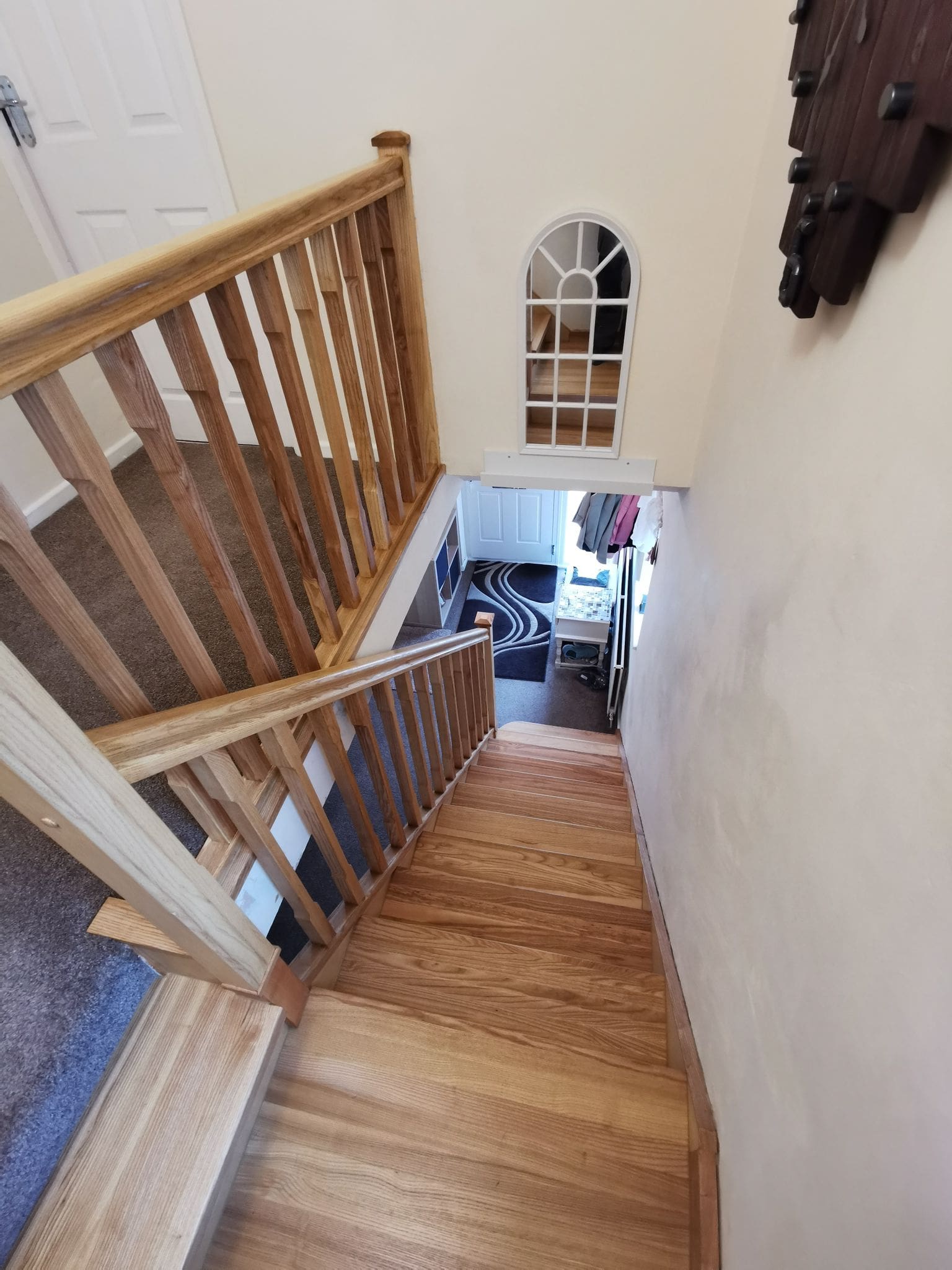 Hardwood Ash Staircase cladding featuring single winder and one landing